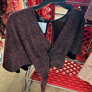 Burgundy crop top, open back with tide on the bottom